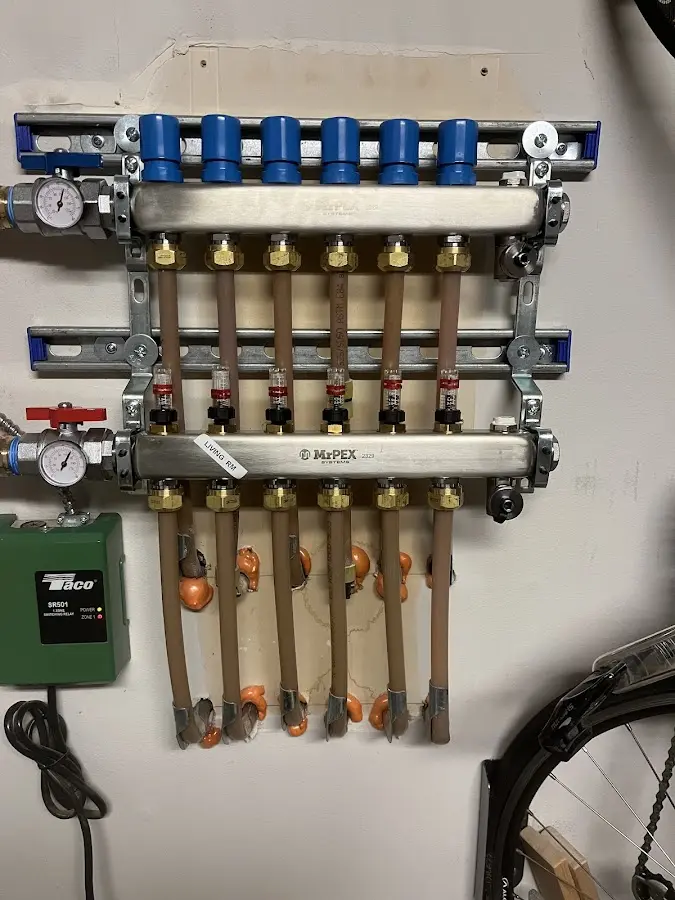 Plumber performing Water Heater Repair at a residential property in Maquoketa